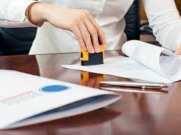 Certified notary handling DMV forms, vehicle registration, and title transfers